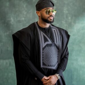 Man wearing a Black Agbada with mordern Embroidery Design
