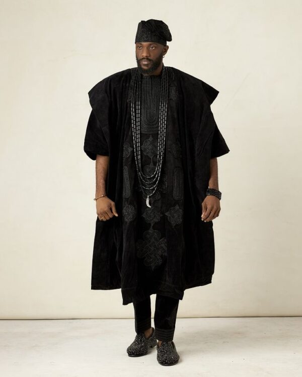 Nigerian Groom dressed with Royal Black Agbada Design