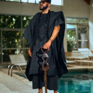 Ebuka Obi in Black Mini Agbada short sleeves with Native Staff